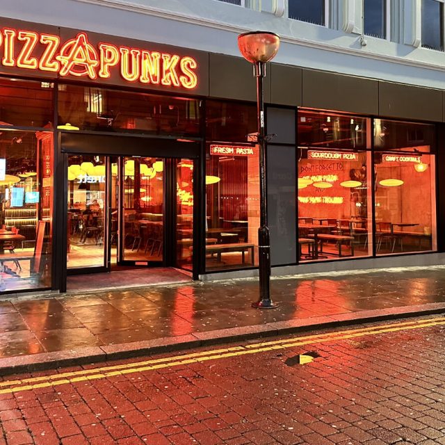 Pizza Punks exterior with neon sign